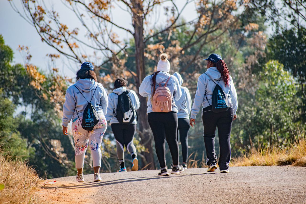 A group of hikers enjoying a walk on a sunny day in Manzini, Eswatini.